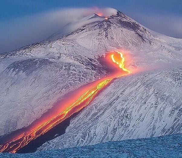 Lava flow on the snowy Etna