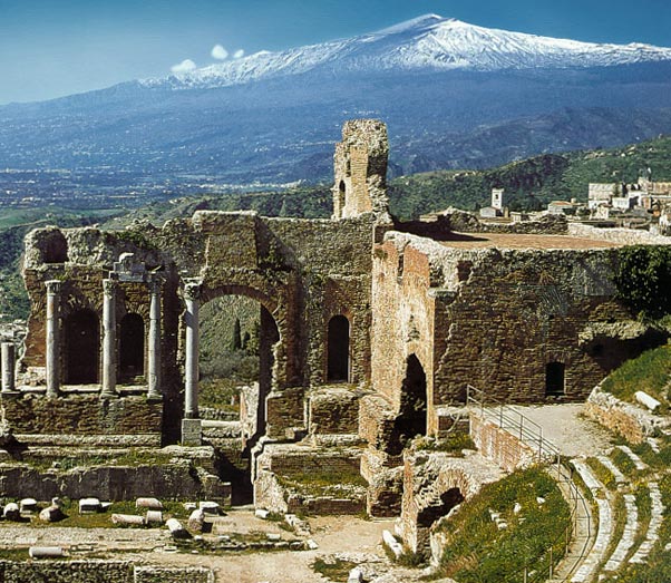 The Ancient theatre of Taormina with the Etna